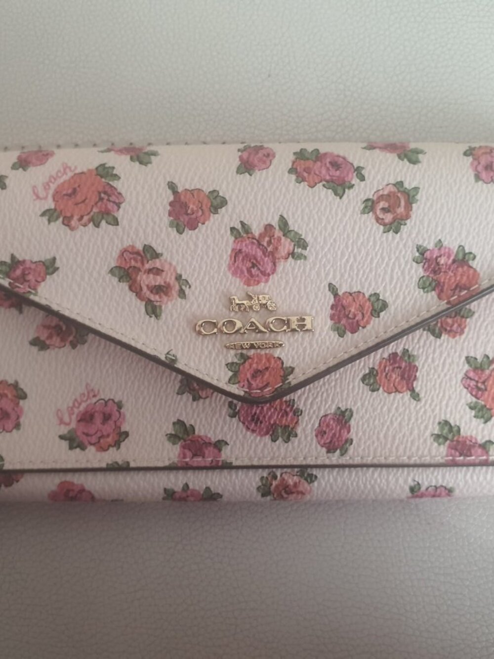 Brand new Coach floral slim wallet. Never used.